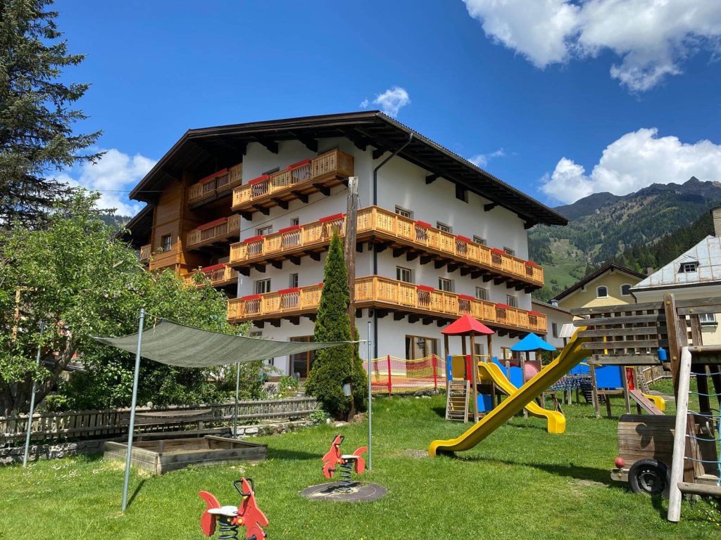 Family hotel with playground and mountain views in Dorfgastein, ideal for summer and winter vacations